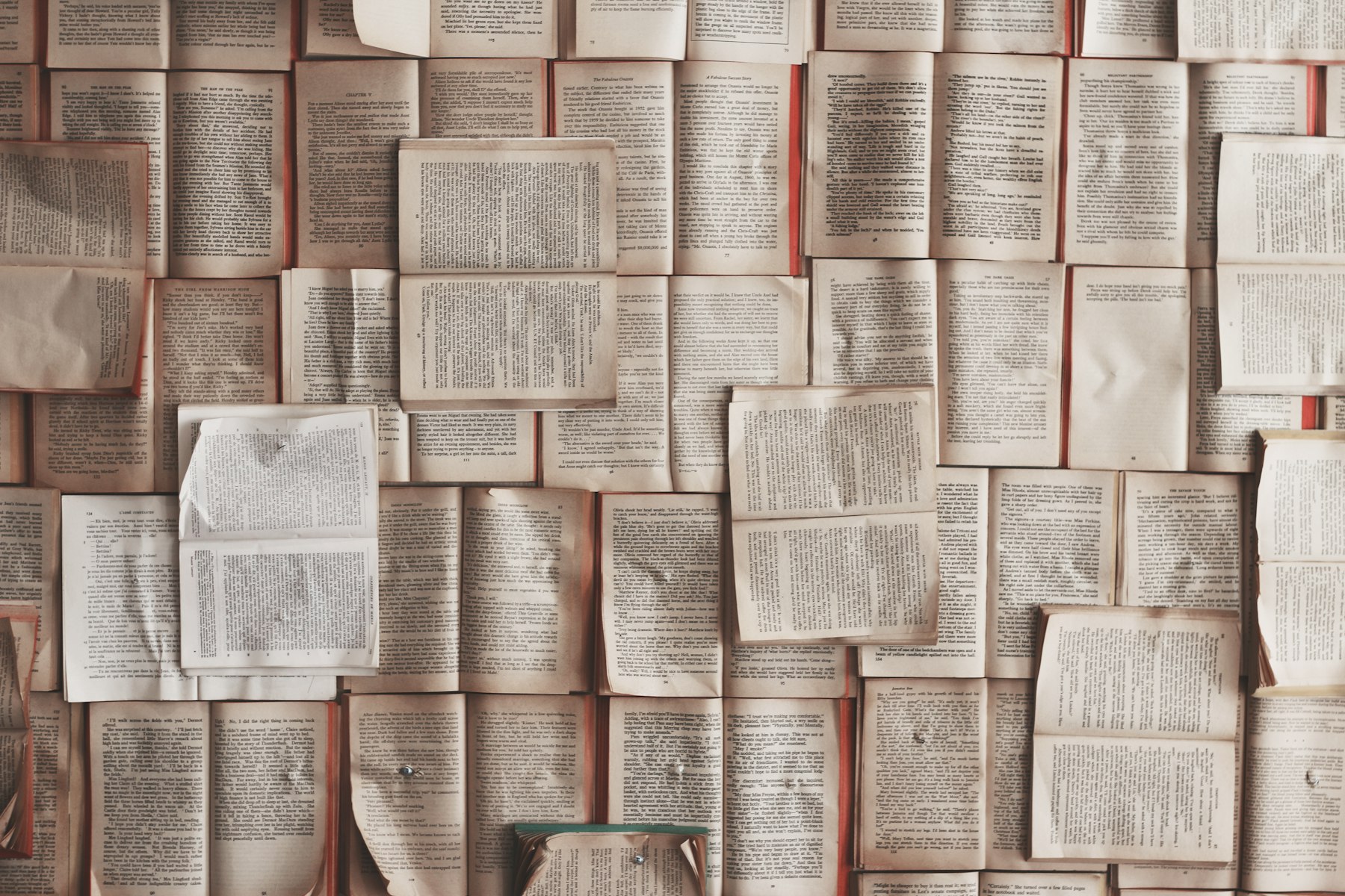 A stack of books on a dark surface